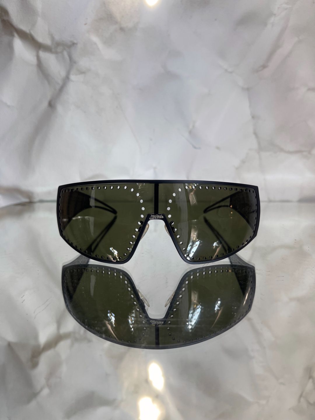 2000s Jean Paul Gaultier unisex black punctured shield sunglasses by JEAN PAUL GAULTIER in size ONE SIZE from ACCESSORIES category